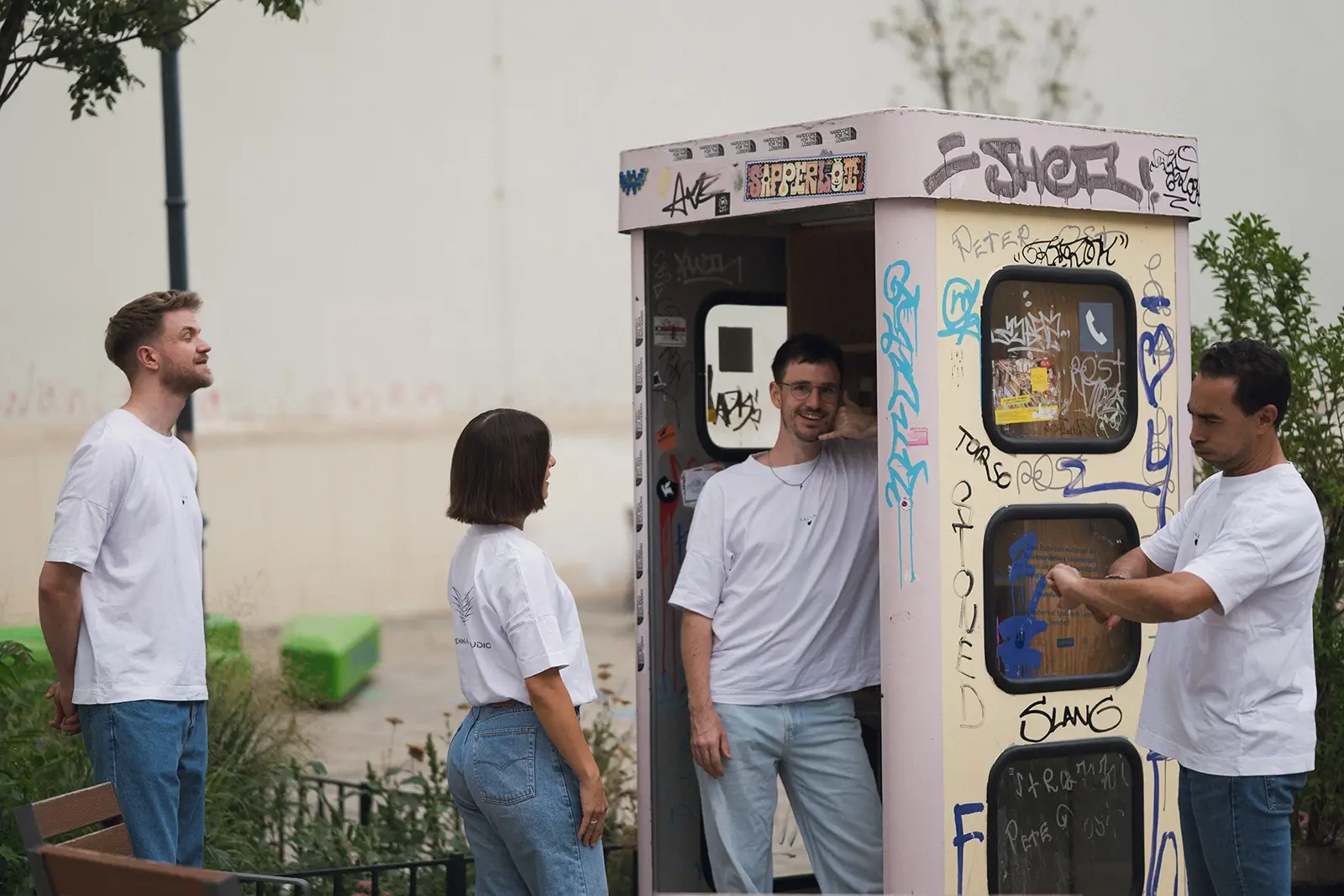 Vienna Salsa Studio team in a telephone booth